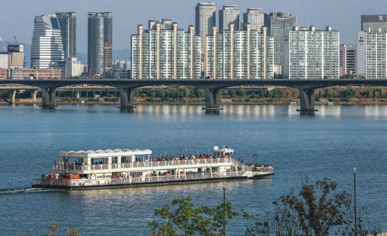 Cruise boat on the Han River with the Seoul skyline