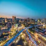 Seoul city center at night for planning a Seoul travel budget